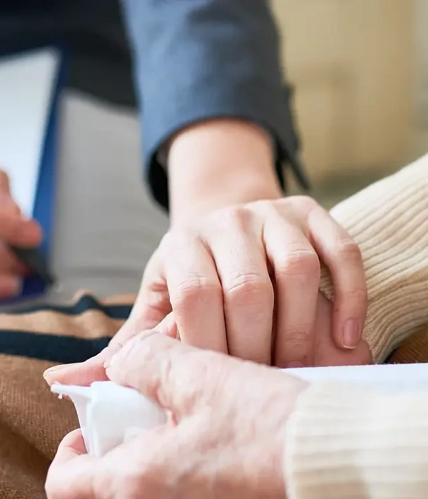 liberty-therapy-couple-holding-hands-while-sitting-couch-page