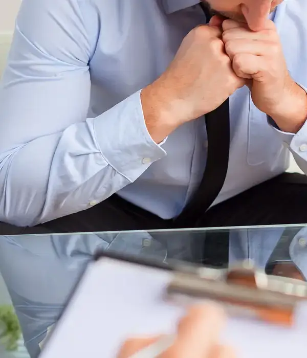 liberty-therapy-man-blue-shirt-tie-sitting-desk-page