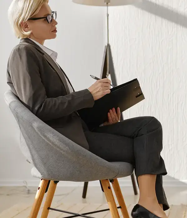 liberty-therapy-woman-sitting-chair-book-page