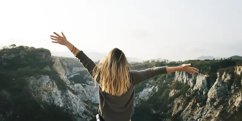 sitting on a cliff