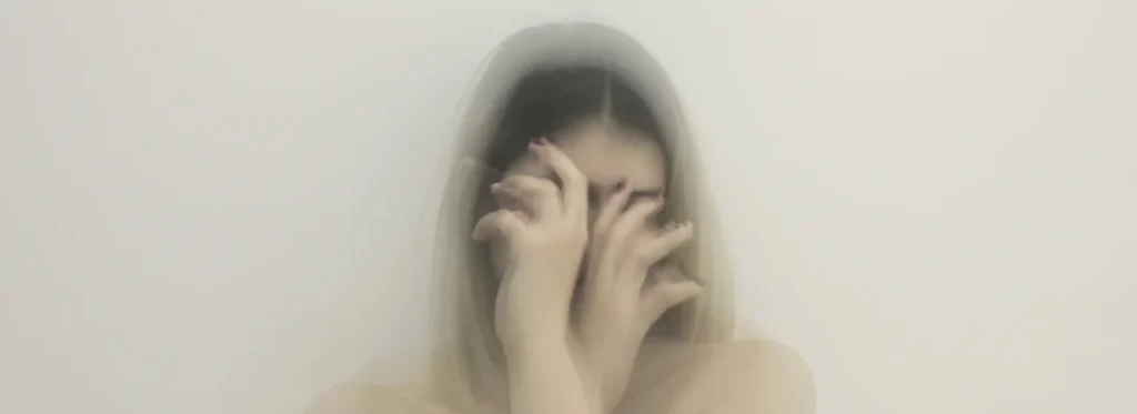 woman covering her face