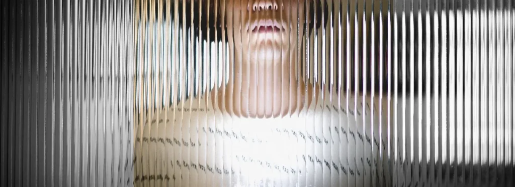 woman behind metal
