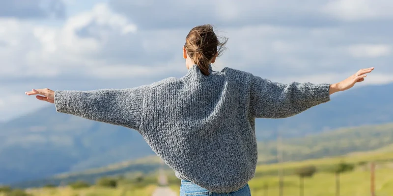 woman in grey sweater