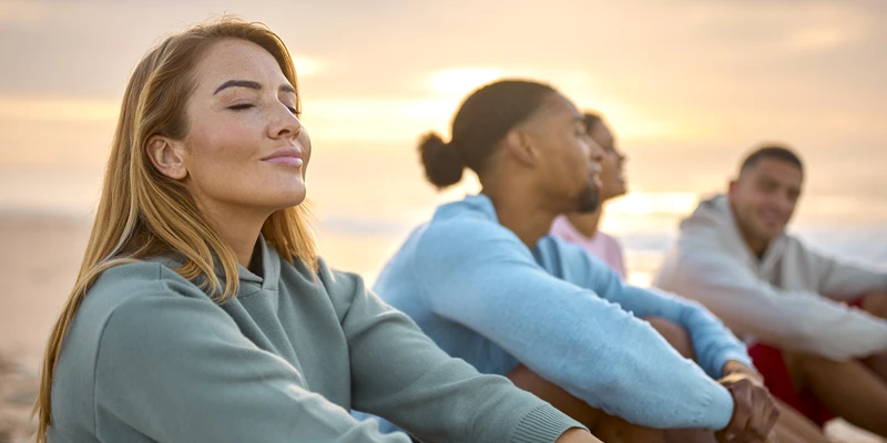 woman with closed eyes with friends